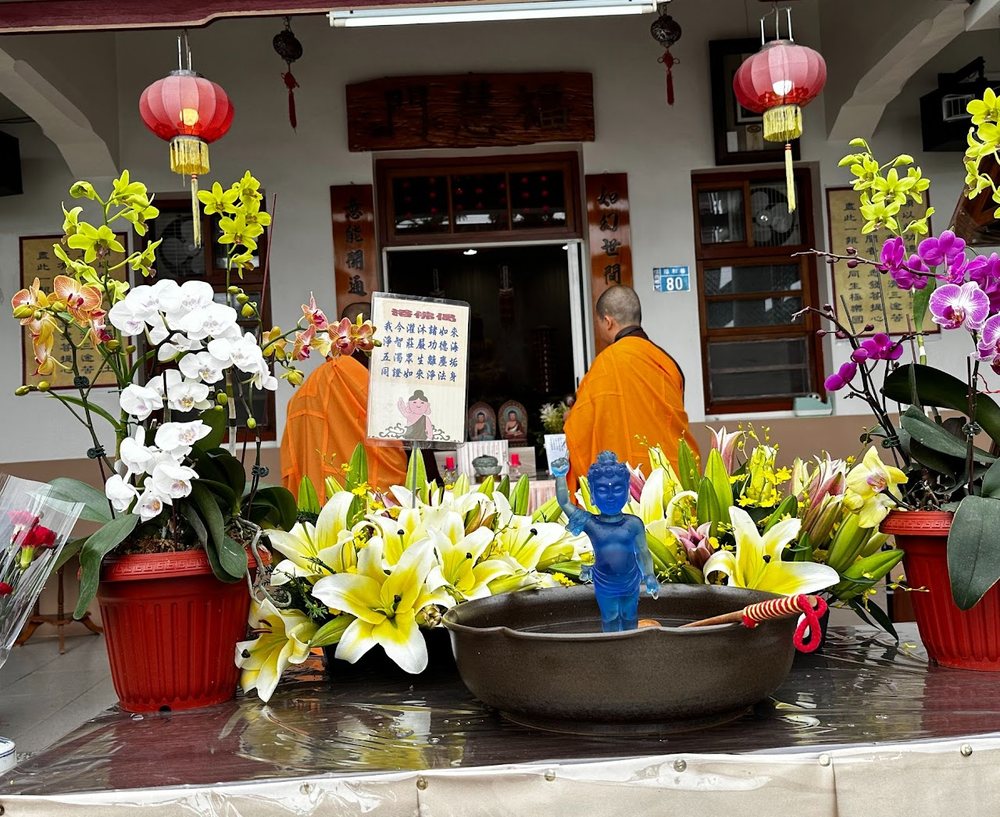 The infant Buddha among flowers at the Bathing the Buddha ceremony